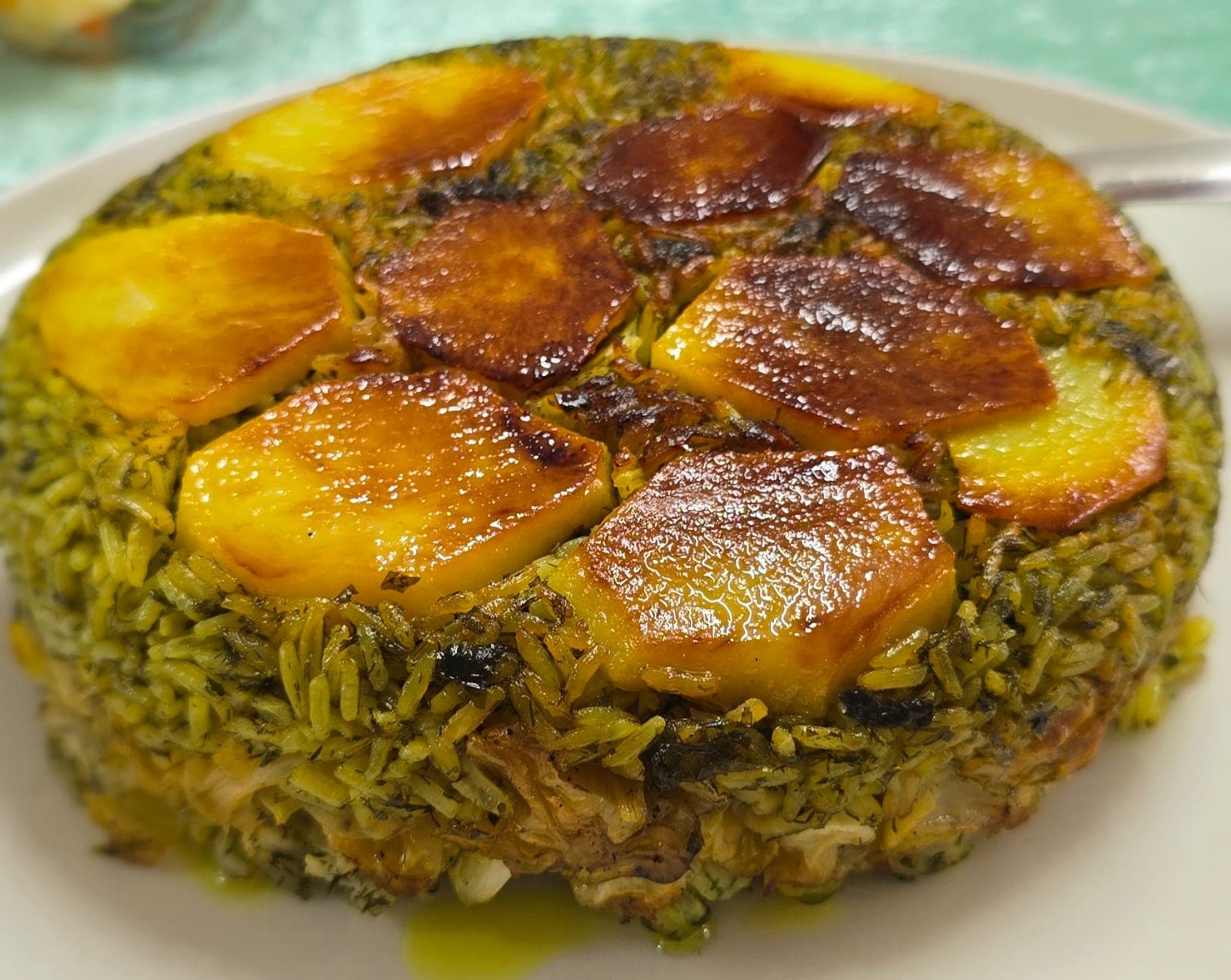 Polo Kalam — Persian herb rice topped with a golden potato tahdig crust